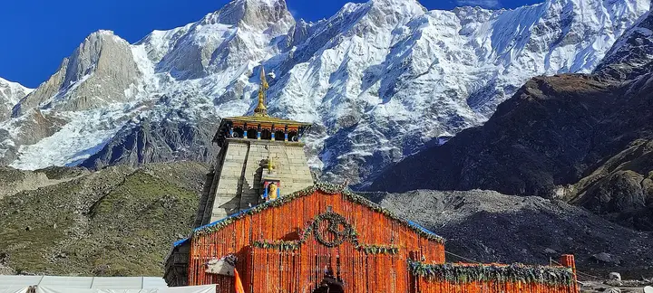 Kedarnath temple below snow-covered Himalayan peaks in October